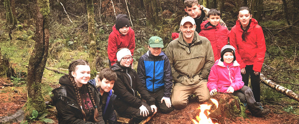 First man Out Ed Stafford teaching children bushcraft skills at Forest Holidays