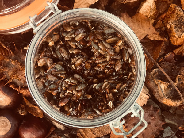 A jar of honey roasted pumpkin seeds