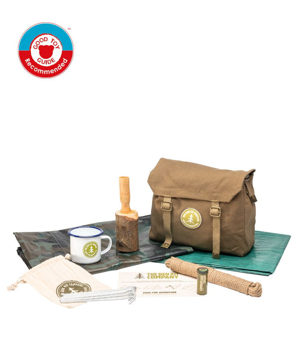 Outdoor adventure kit with backpack, mug, and camping accessories on a white background