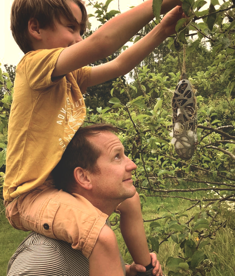 Father and son help nesting birds